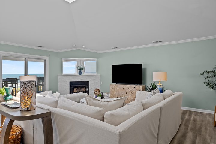 Living room seating area with sectional sofa and skylight