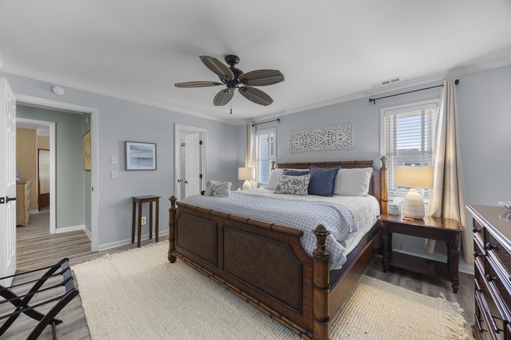 Guest bedroom with bamboo four-poster bed and window light