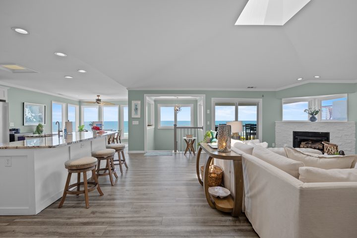 Entry walk-in to the open living level with ocean light through the front windows