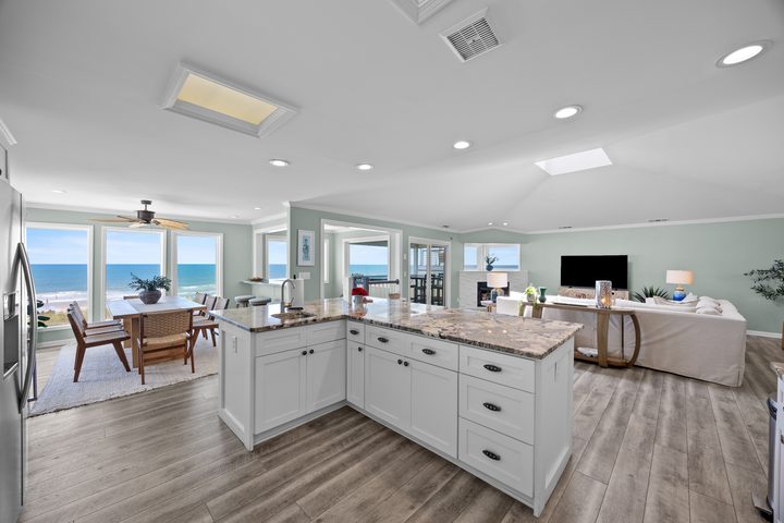 View across the kitchen, living, and dining rooms
